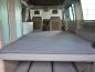 Lower bed mattress topper for the lower bed